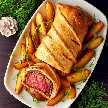 Sliced beef Wellington in golden puff pastry, a holiday recipe featuring Super King Markets meat